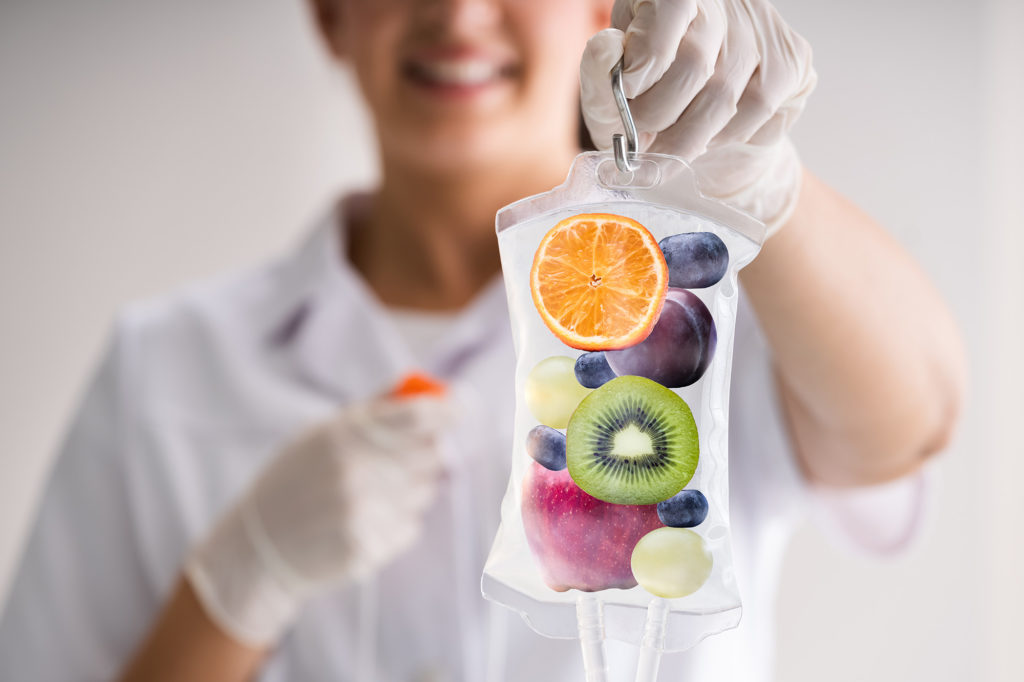 A Female holding a fruits bag | wellness iv infusion therapy | Melindas Medical Spa & Salon